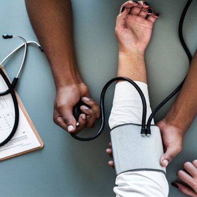 Nurse-Checking-Medical-Fitness-of-Employee