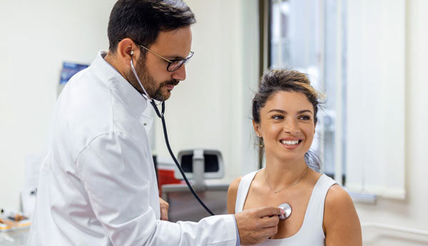 Occupational-Therapist-Conducting-Routine-Medical-Exam-on-Patient-2023